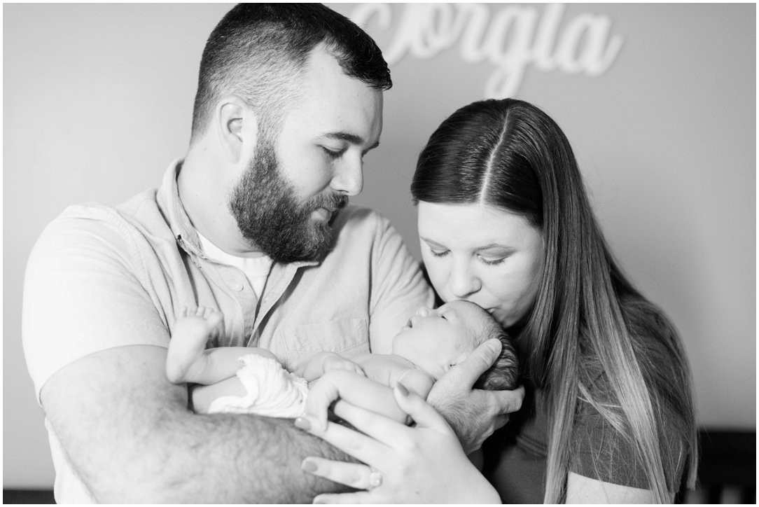 newborn with mom and dad black and white