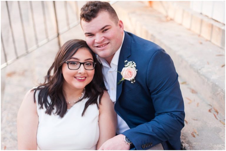 bride and groom sitting on steps