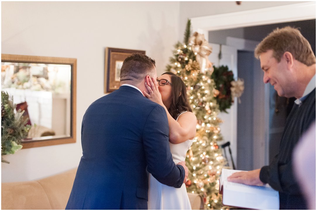 couple kissing at small wedding