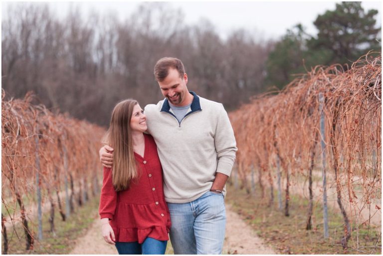 couple walking through winery