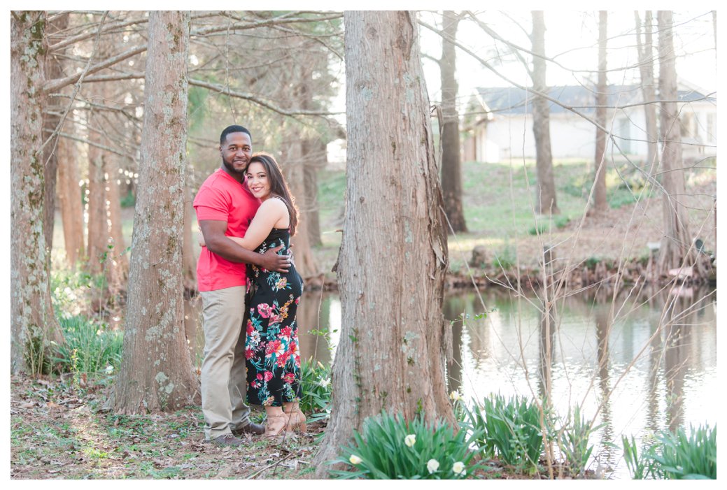 couple by pond in spring