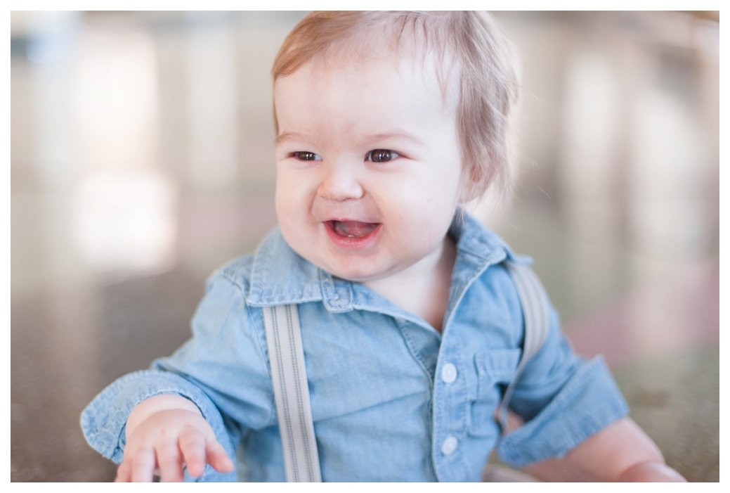 little boy laughing in blue