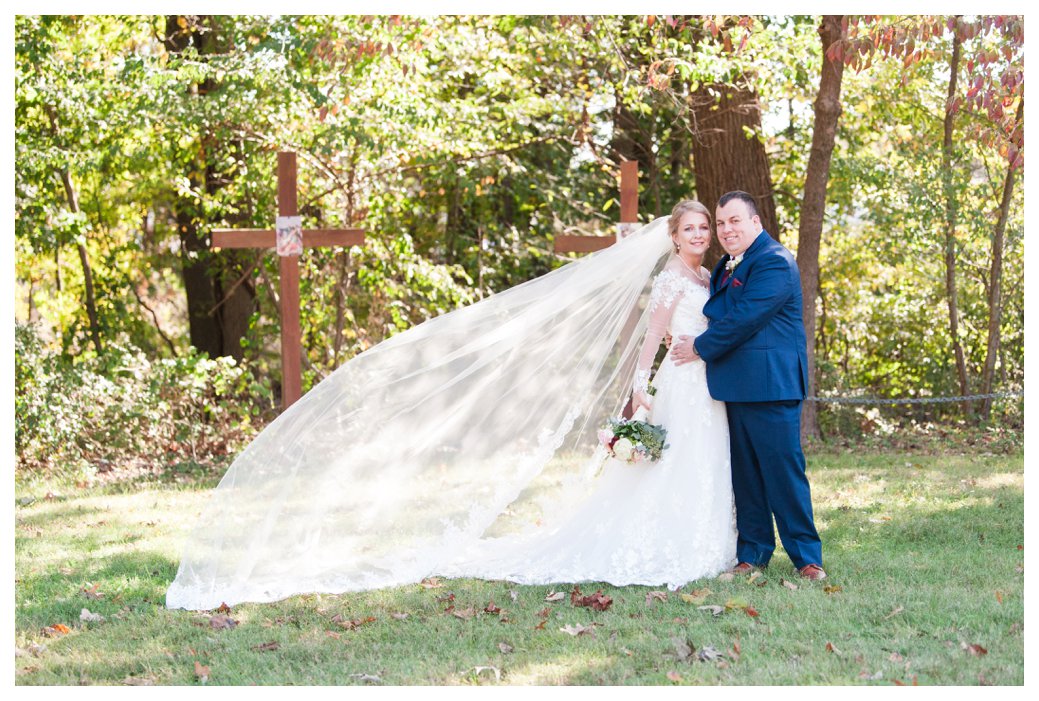 bride and groom outside with long veil best of 2019 Tracye's Photography