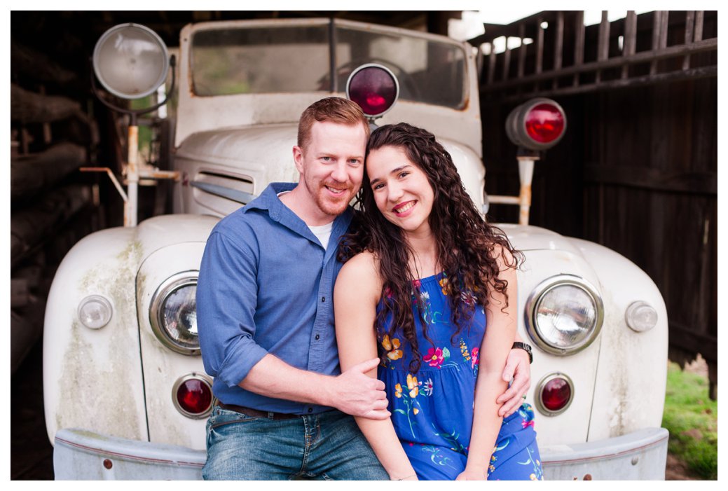 couple in front of old car