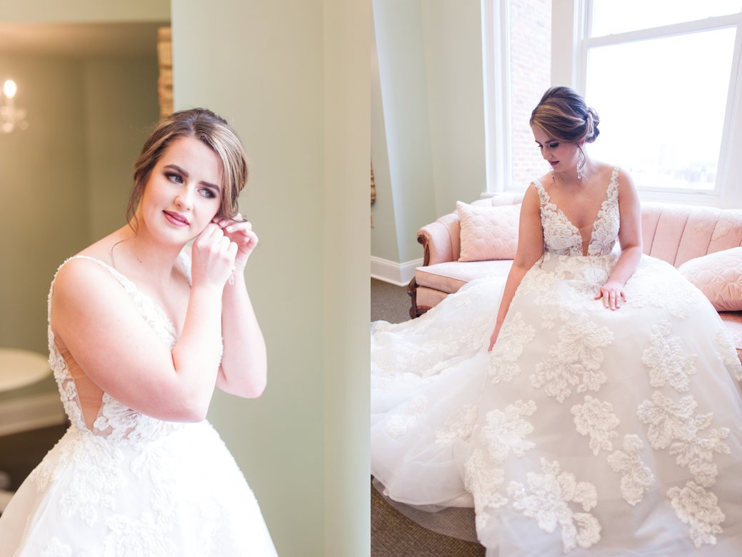 bride putting in earrings and sitting on couch