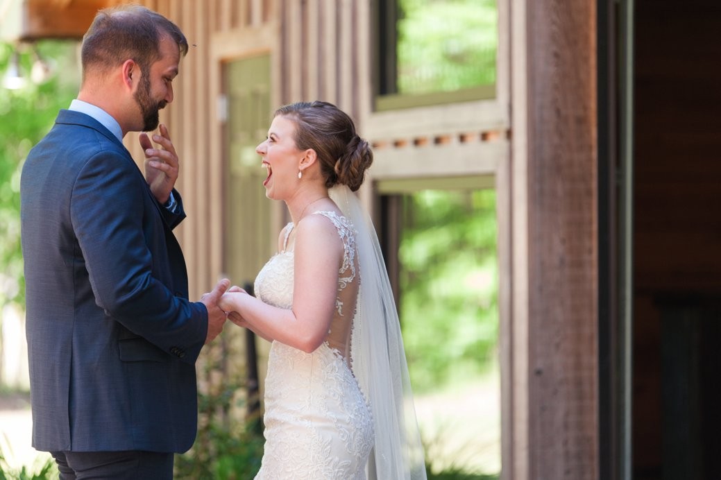 K & M Barn couple laughing together