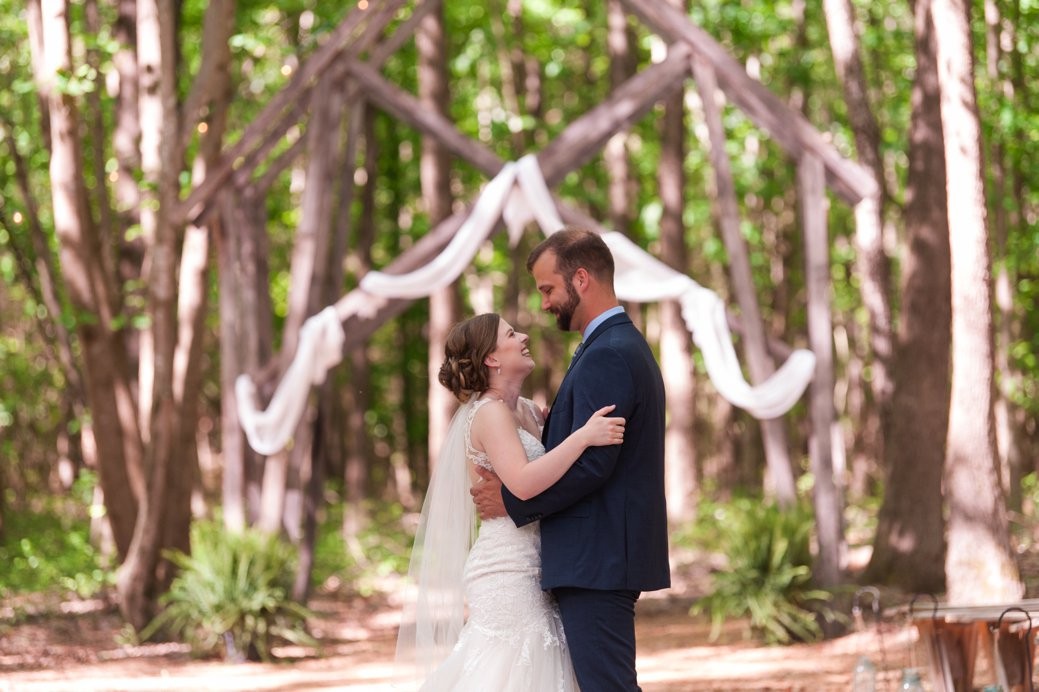 K & M Barn bride and groom in aisle