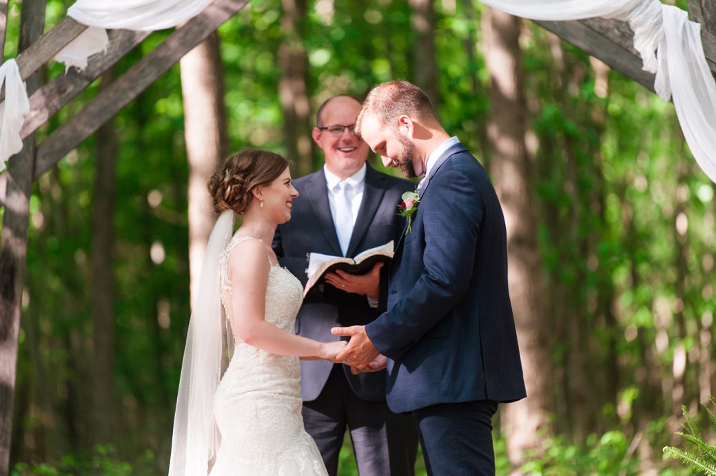 K & M Barn couple saying vows