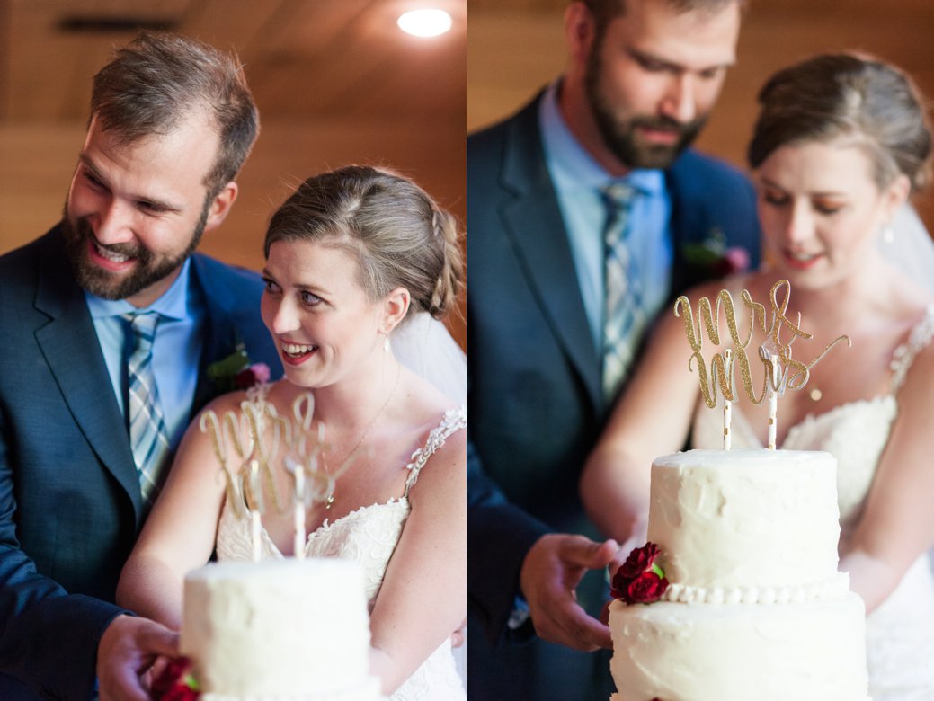 K & M Barn bride and groom with cake