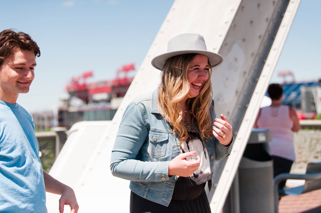 girl smiling on bridge