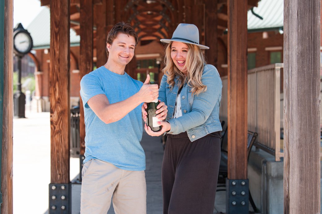 newly engaged couple with champagne