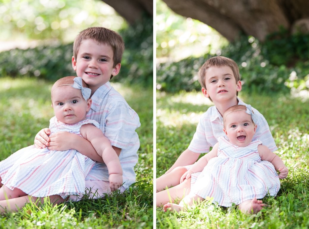 little boy holding baby sister