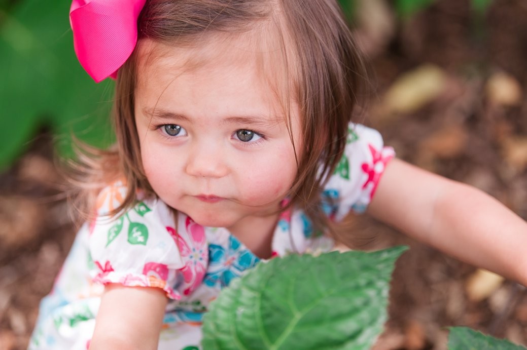 little girl in leaves