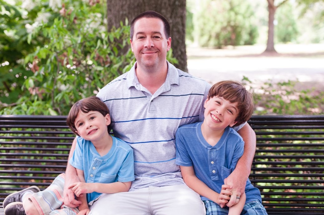 dad with sons on bench