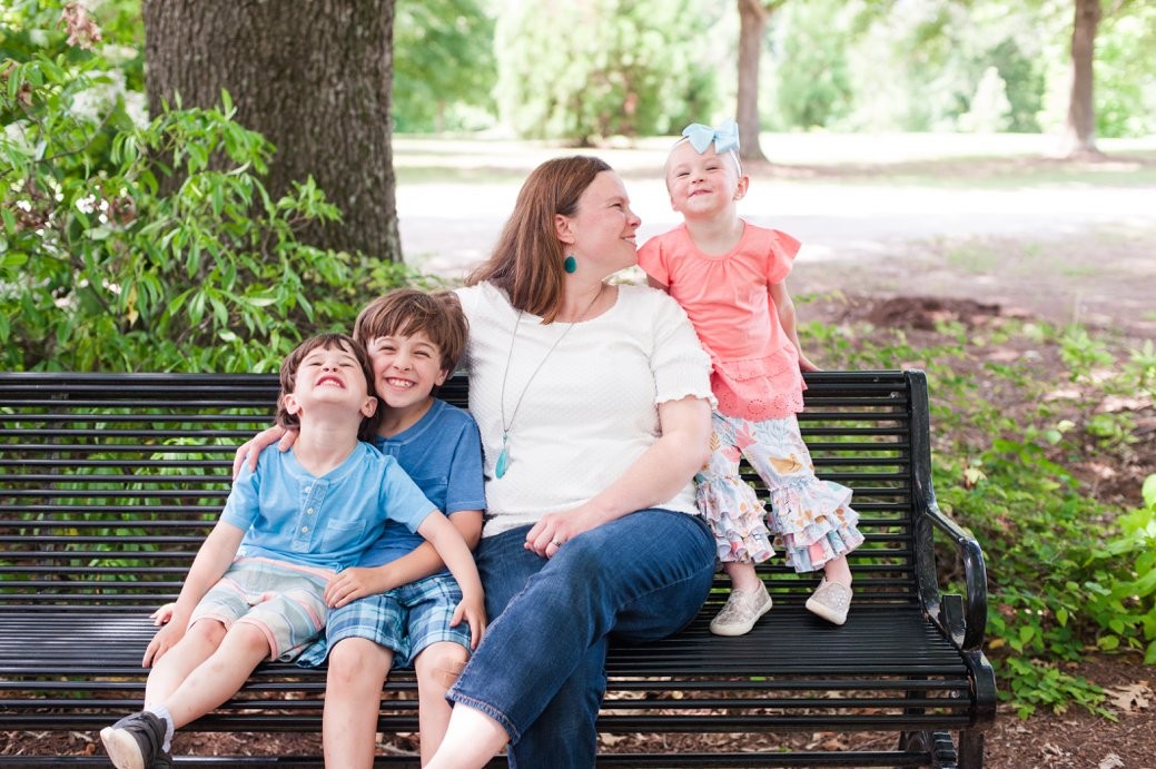 mom with kids on bench