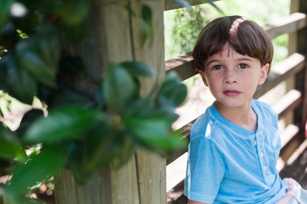 boy on bench in blue