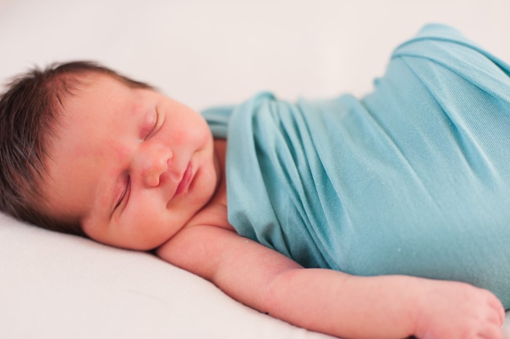 mcintyre newborn session baby smiling