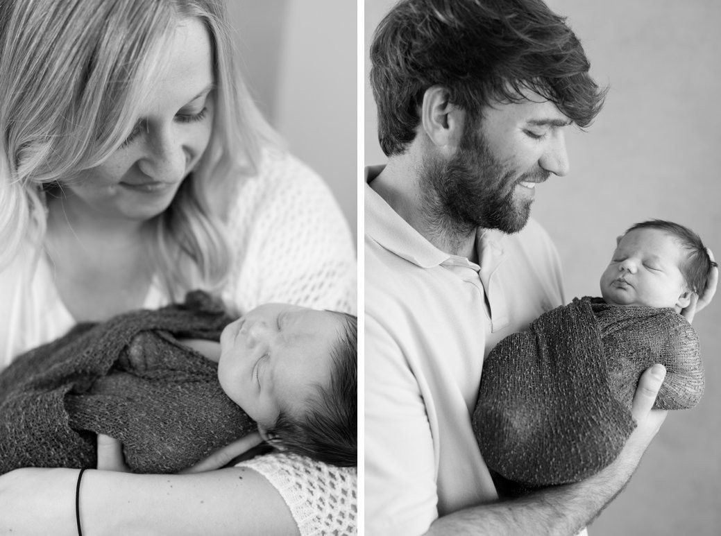 parents and baby in black and white