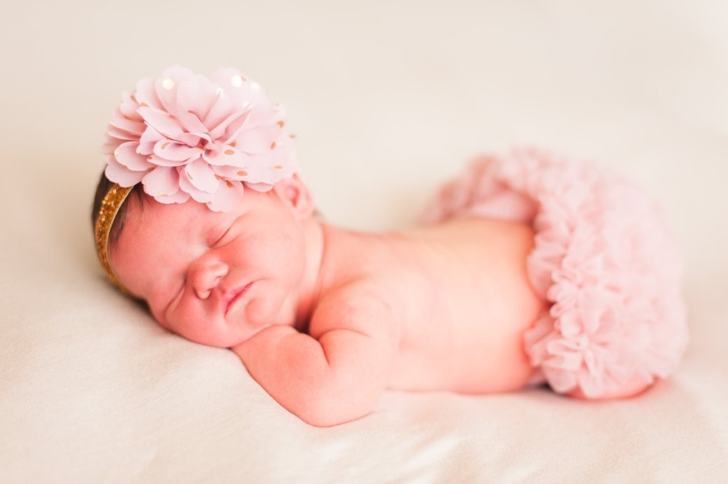 baby in pink ruffle bum and bow