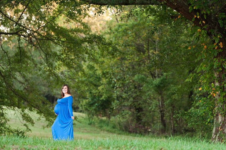 maternity portraits blue dress in woods