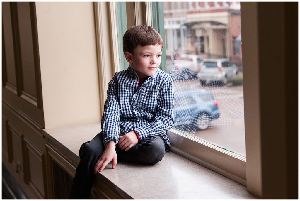 Newborn Family Session little boy in window