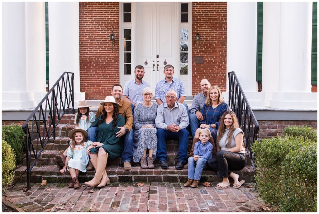 Family on steps of historic home