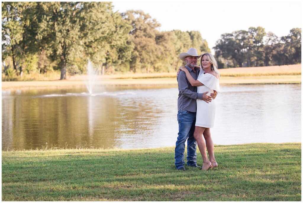 engaged couple by pond