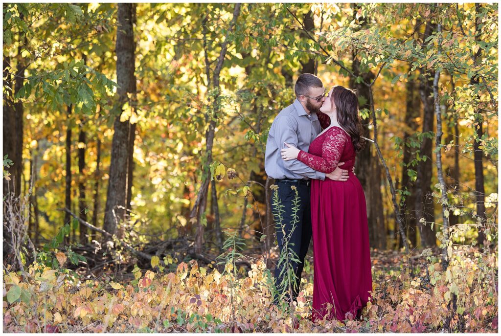 Couple kissing in the tress at park