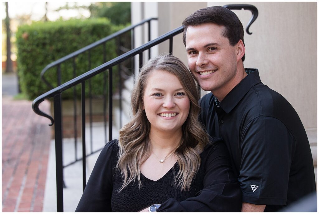 Couple sitting on stairs engagement session