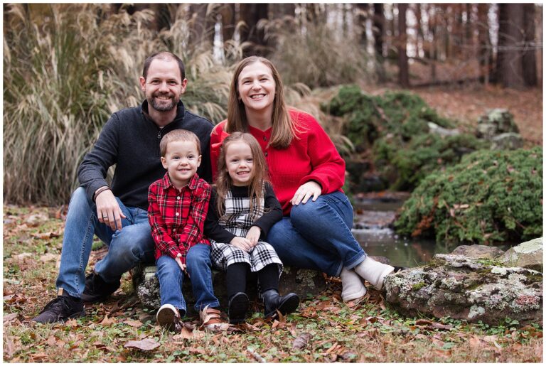 Family portrait beside pond